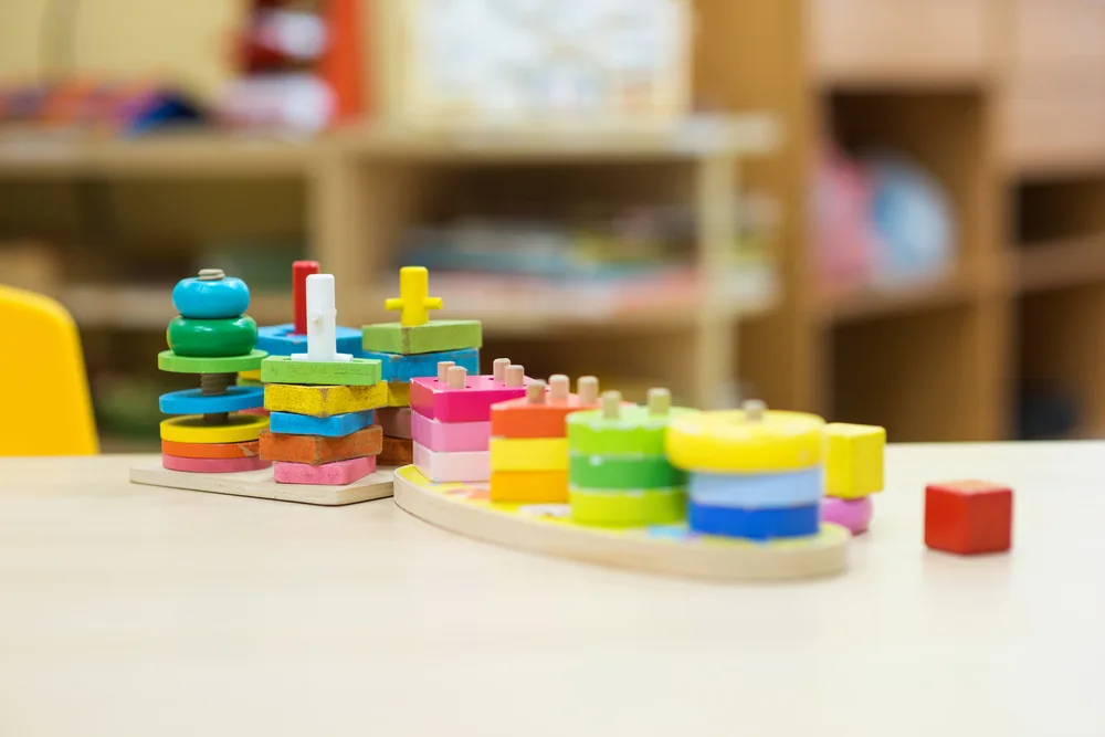 Preschool shelf with stackable puzzle. 