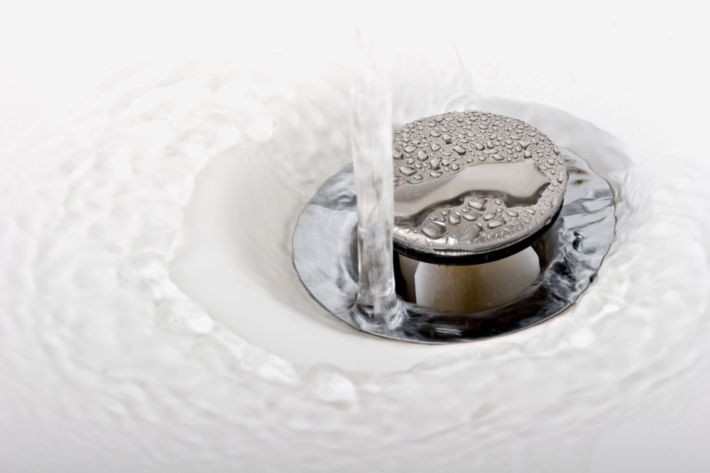 water runs into sink drain