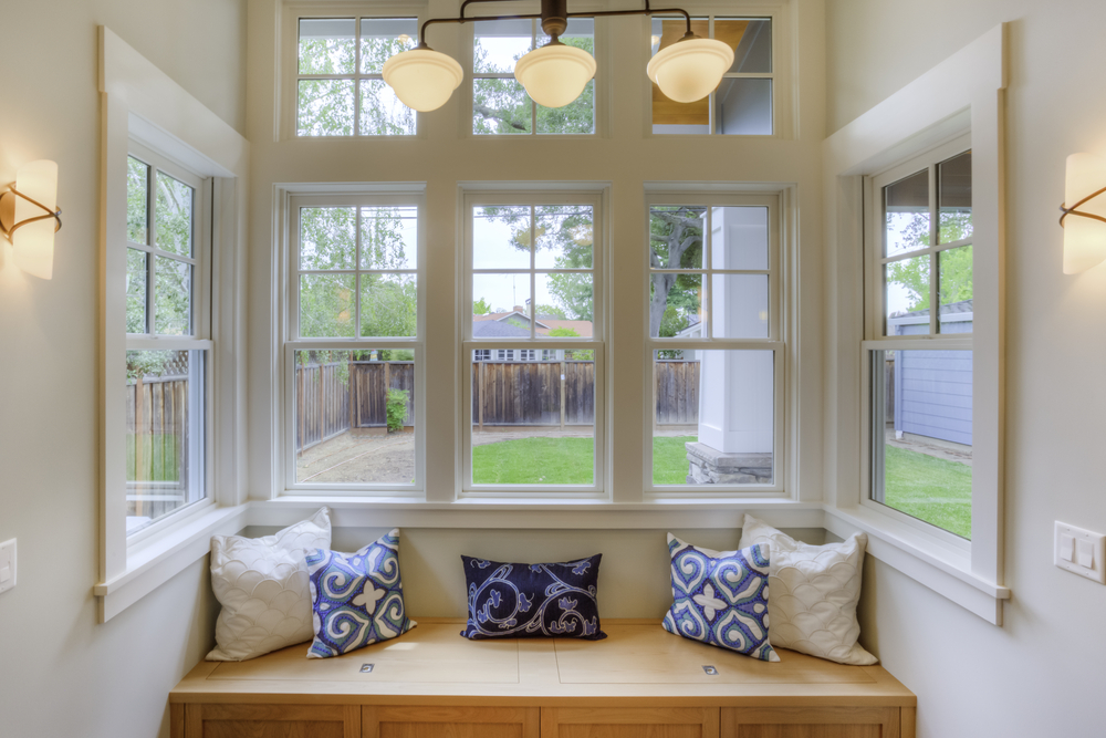 Window seat allowing ample sunlight to enter the room