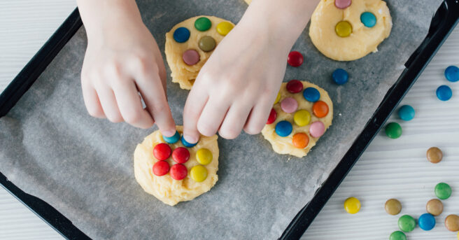 Child making homemade cookies.