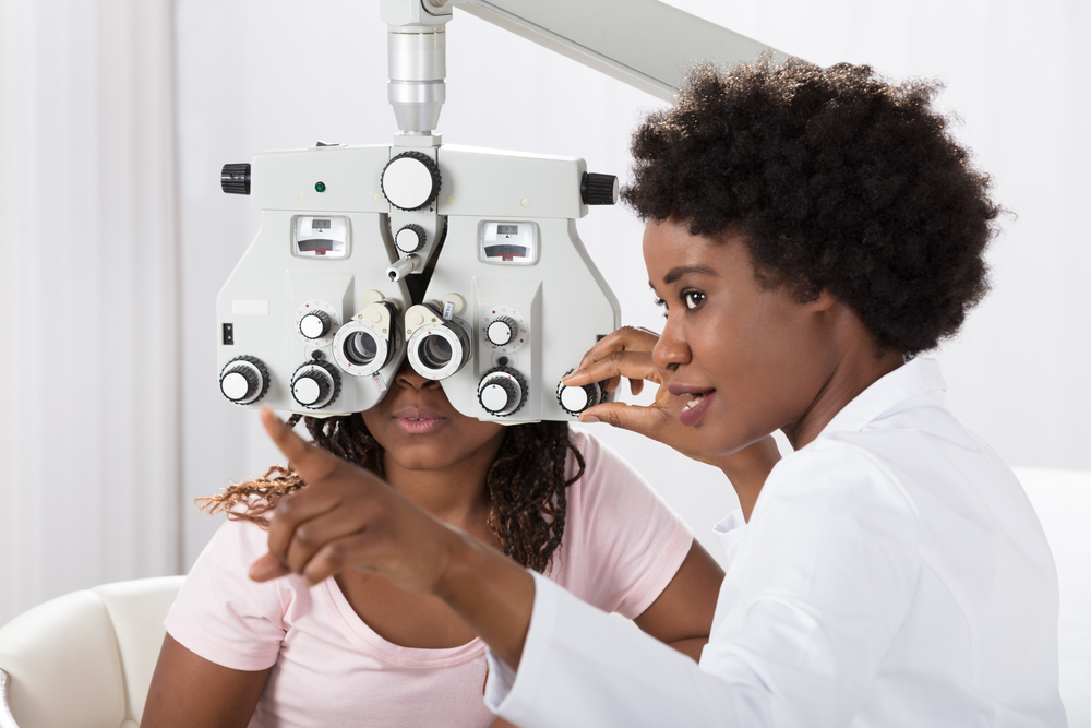 eyecare professional giving an eye exam