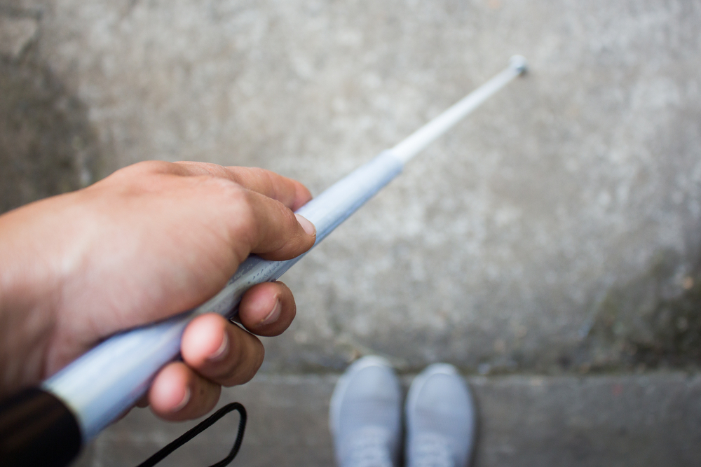 close-up of a white cane in use