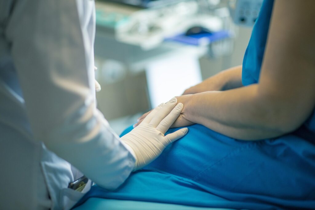 medical professional comforting patient