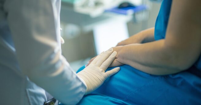 medical professional comforting patient