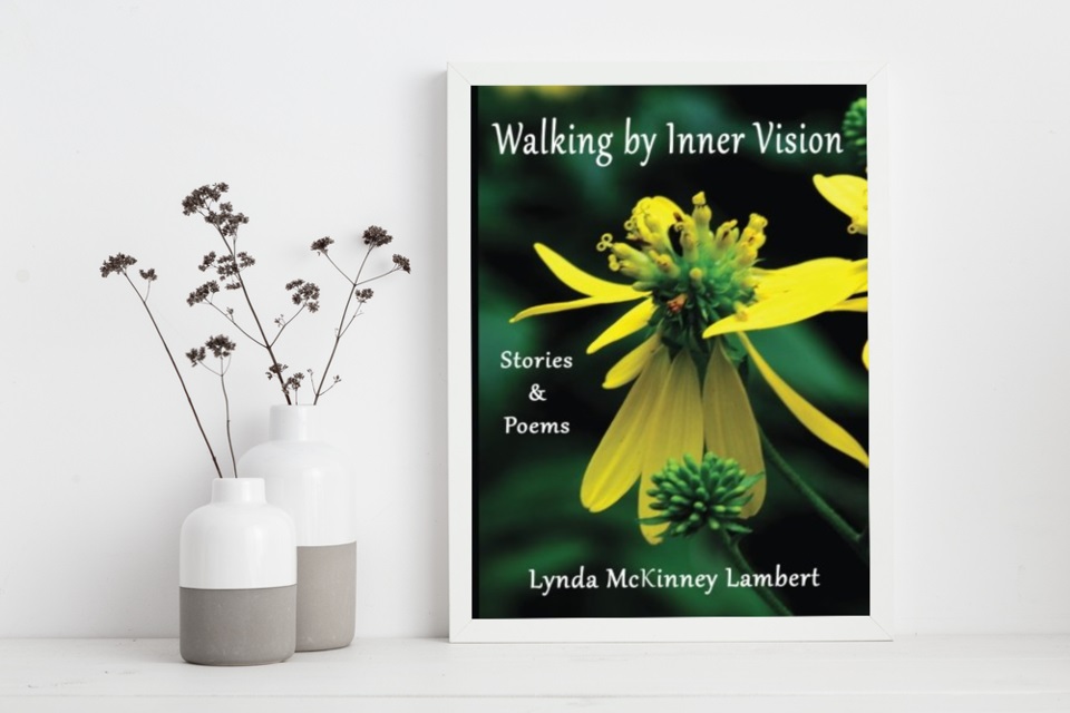 picture of book cover "Walking by Inner Vision" featuring large yellow flower