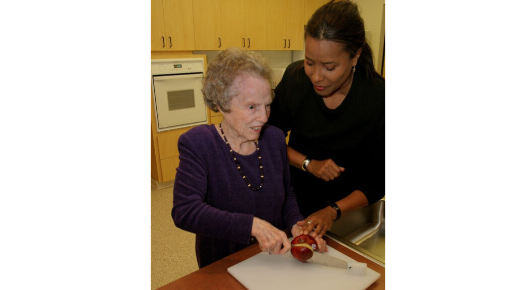 older woman learning to chop with help of VRT
